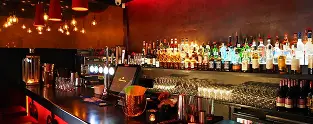 Cozy London bar with a vibrant atmosphere, ideal for guests staying in rooms for rent in London who want to experience the local nightlife.