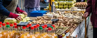 Bustling artisan food market in London, offering fresh local flavours for those renting a room London to enjoy.